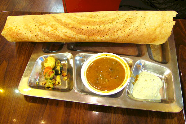 Photo of a dosa from the Dosa Factory, a Cambridge restaurant that has an instructional video within our site (via how2heroes).