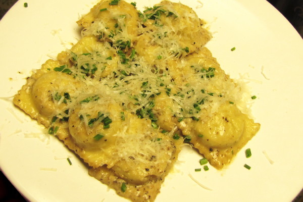 photo of homemade gorgonzola and walnut ravioli in white truffle brandy cream sauce