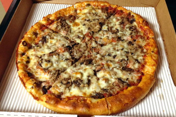 photo of a mushroom and hamburger pizza from New London Pizza, a sub shop and pizza place on Thoreau Street in Concord, MA