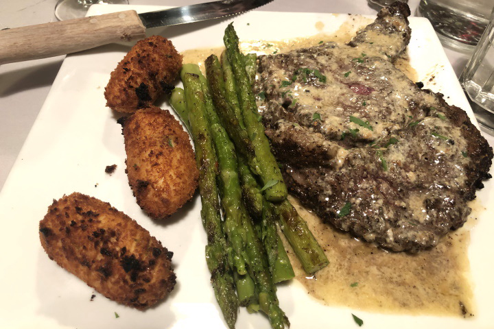 photo of ribeye with blue cheese sauce from Rino's, East Boston, MA