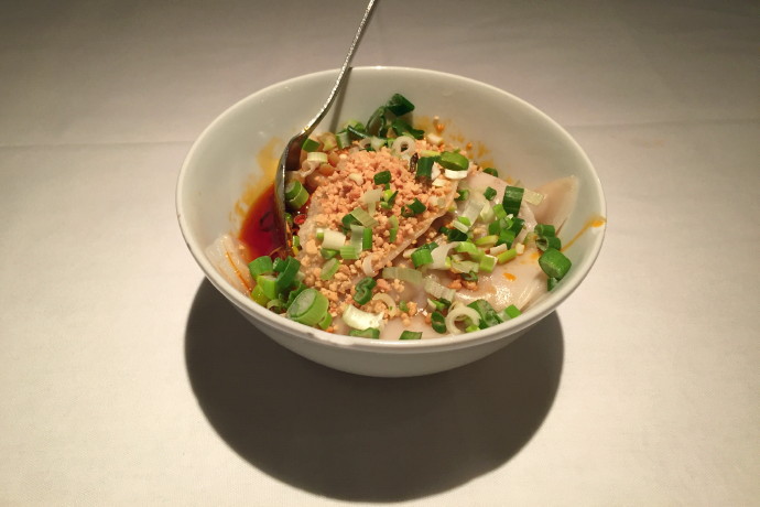 photo of another view of pork dumplings in a roasted chili vinaigrette from Sichuan Garden, Brookline, MA